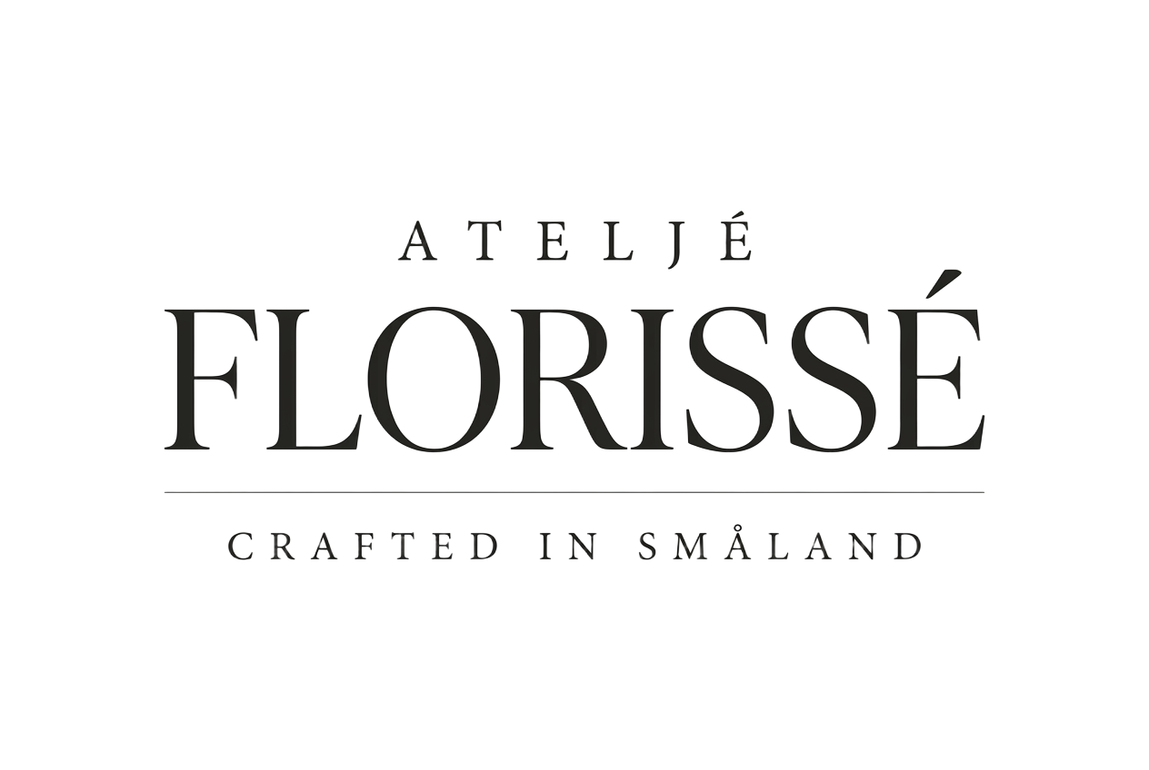 An airy floral arrangement in a black Florissé base